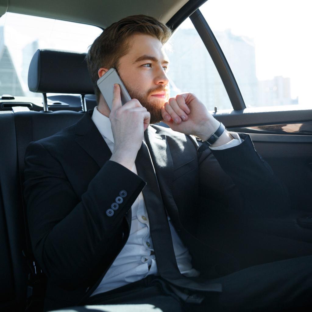 business man on phone in GoRa Taxis